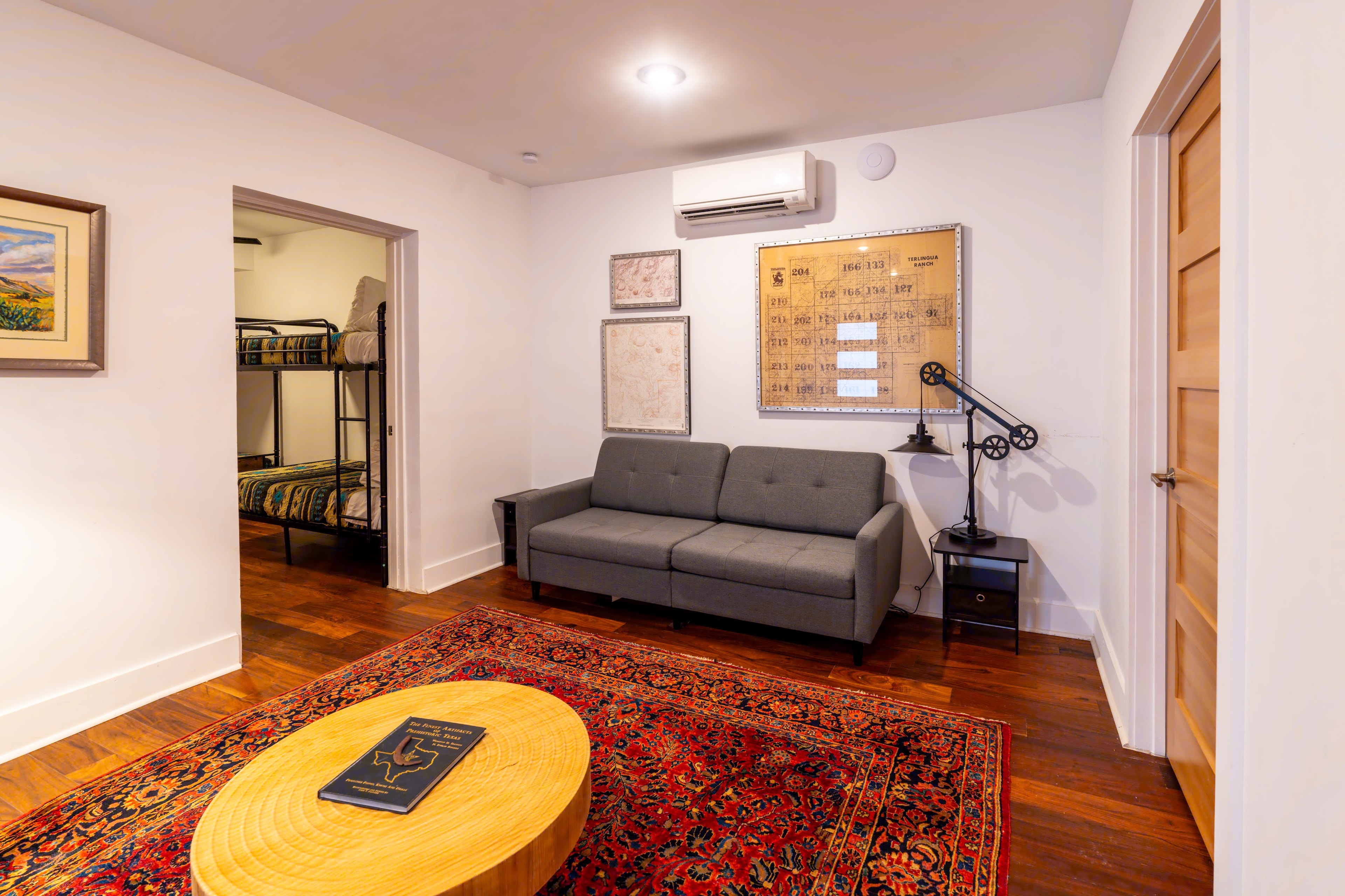 Living room area with bunk beds visible