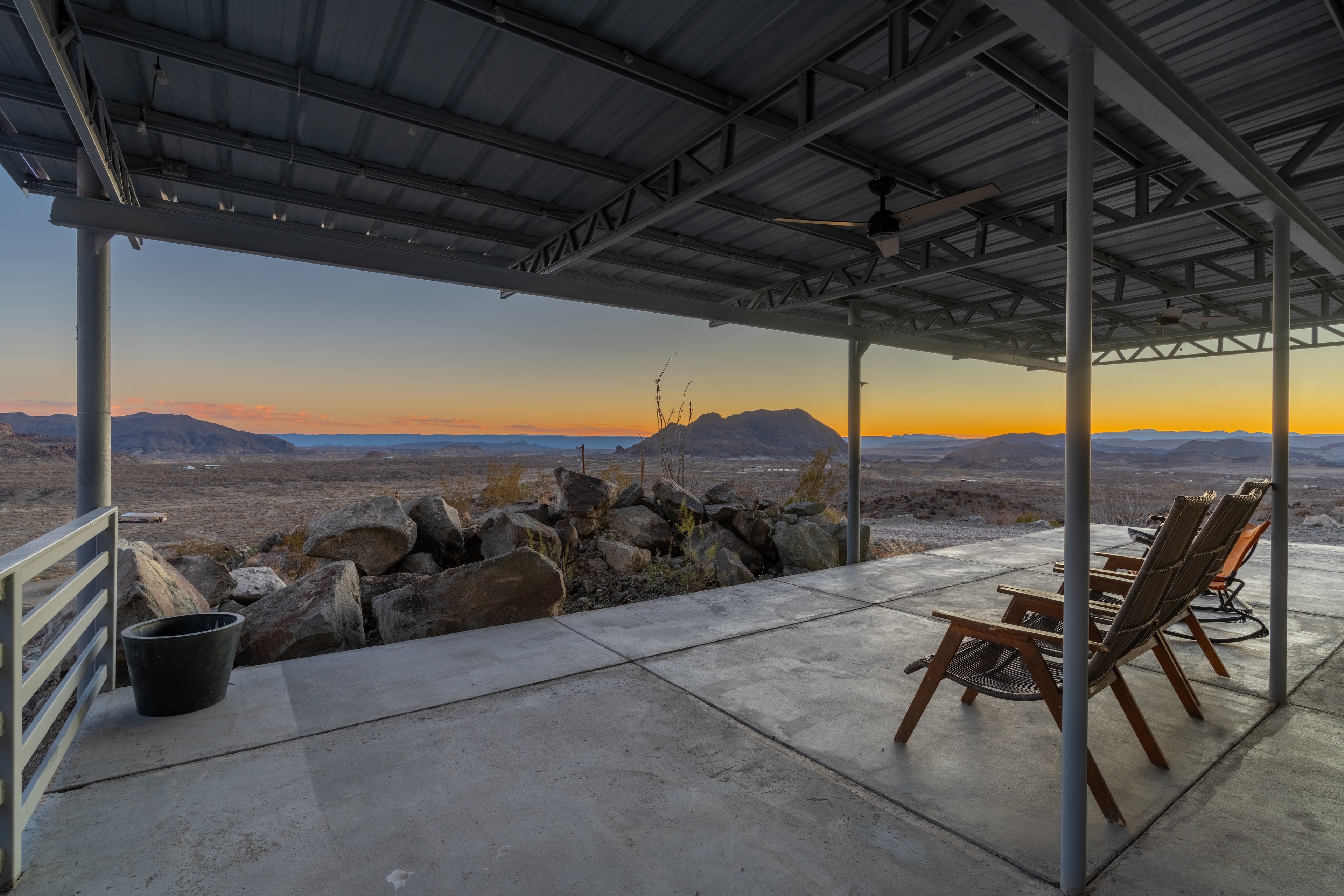 Wraparound deck at Willow Mountain Ridge overlooking the desert mountains at sunset